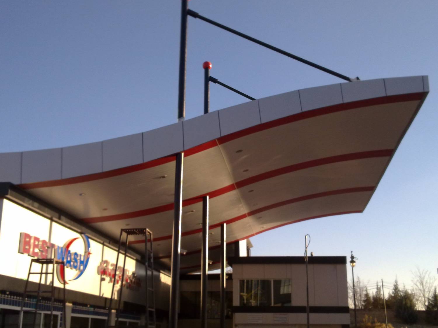 Completed canopy exterior — cable stays and mast visible against sky