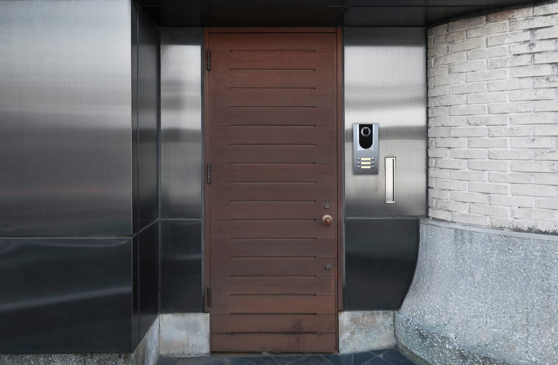 Installed panel, steel finish, on a stainless steel and stone modern entrance